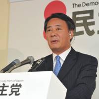 Sifting the ruins: Democratic Party of Japan President Banri Kaieda faces reporters in Tokyo on Sunday night, after the party\'s devastating defeat in the Upper House poll. | YOSHIAKI MIURA