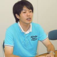 Empowering the poor: Ashinaga anti-poverty campaigner Fuyuki Midorikawa is interviewed at the charity group\'s headquarters in Chiyoda Ward, Tokyo, July 8. | TOMOHIRO OSAKI