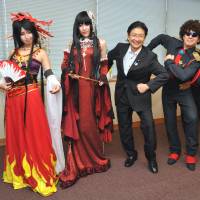 All in a day\'s play: Parliamentary Vice Foreign Minister Kenta Wakabayashi (third from left) poses with Chinese, Italian and Brazilian participants of World Cosplay Summit 2013 on Tuesday during their courtesy visit to the ministry. A total of 40 \"cosplayers\" from 20 countries are taking part in the annual event, which began Saturday in Nagoya and runs until Aug. 4. | YOSHIAKI MIURA