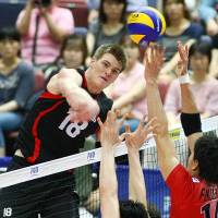 Like a hammer: Canada\'s John Gordon Perrin spikes the ball against Japan in their FIVB World League match on Saturday afternoon in Osaka. Canada won the four-set Group C match. | FIVB