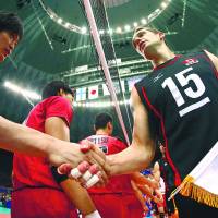Friendly introductions: Canada captain Frederic Winters (right) takes part in pre-match handshakes before Saturday\'s Japan-Canada Group C mach in the FIVB World League in Osaka. | FIVB