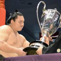 A winner\'s reward: Yokozuna Hakuho is handed the Emperor\'s Cup for the 26th time in his illustrious career on Sunday. Hakuho took home the top prize at the Nagoya Grand Sumo Tournament. | KYODO