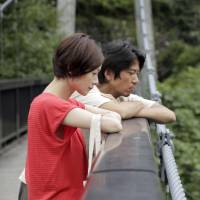 Staring at the abyss: Yoko Maki and Shima Onishi, seen in a still from \"The Ravine of Goodbye,\" portray a couple involved in a rape case. | 2013 SAYONARA KEIKOKU SEISAKU IINKAI/KYODO