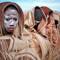 Rite of passage: Boys from the Xhosa tribe sit out in the open as part of a traditional circumcision ceremony near Qunu, South Africa, on Sunday.  The nation\'s first post-apartheid president, Nelson Mandela, grew up in Qunu. | AFP-JIJI