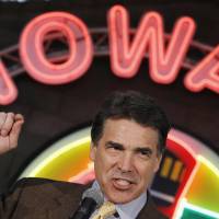 National stage: Texas Gov. Rick Perry makes a campaign stop at the Iowa 80 truck stop in Walcott, Iowa, during his ill-fated bid for the Republican presidential nomination in August 2011. Perry leaving Texas office, doesn't rule out '16 bid