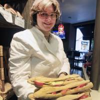 Factory-fresh?: A chef displays sandwiches at a restaurant in Paris. A new study shows that a third of French restaurants are adding frozen meats to their dishes because they are cheaper and easier to manage. Dramatic rise of factory-made meals in France causes outrage