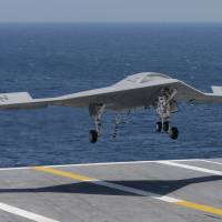 Making history: An X47-B U.S. Navy drone approaches the deck of the aircraft carrier USS George H.W. Bush off the coast of Virginia on Wednesday. | AP
