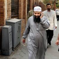 False target: Egyptian cleric Osama Hassan Mustafa Nasr, known as Abu Omar, who was allegedly kidnapped by CIA agents off the streets of an Italian city and taken to Egypt where he said he was tortured, makes a call in April 2007 after attending an Amnesty International press conference in Cairo. | AP