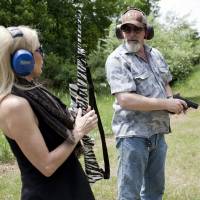 Nugent and his wife, Shemane, shoot guns on their Concord, Michigan, ranch on June 6. The Michigan property has a log cabin/hunting lodge, a shop where they keep their guns, guitars and a few vehicles, a lake with a boat, and numerous gun/bow and arrow ranges. | THE WASHINGTON POST