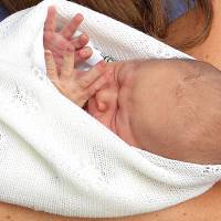 Georgie boy: Britain’s newborn royal baby is held by his mother, Catherine, the Duchess of Cambridge, at his first public viewing Tuesday in London. Palace officials said Wednesday that the 2-day-old baby and third-in-line to the throne will be known as His Royal Highness Prince George of Cambridge. British royal baby's name announced: George Alexander Louis