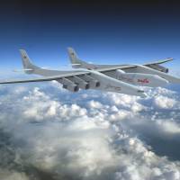 Space race: A rendering shows a Stratolaunch rocket slung beneath a plane that carries it to 30,000 feet before the two craft separate, allowing the rocket to be shot into space. New rocket hopes to take off with launch from the skies