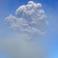 Ash plumes from Mount Sakurajima soar 5,000 meters above the city of Kagoshima after the volcano had a strong eruption at 4:31 p.m. Sunday, logging its 500th of the year. It was first eruption since October 2000 to send plumes so high. Ash darkened the skies above the city and rained down on the tracks of the JR Nippo Line, interrupting service for about 500 passengers. | KYODO