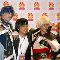 People dressed as characters from animated cartoons and manga pose Friday during a \"cosplay\" event at the Japan Expo at the Santa Clara Convention Center in California. The showcase of popular Japanese culture is making its U.S. debut. | KYODO