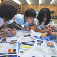 Children learn the basics of European Union member states during a workshop, Children\'s International Festa 2013, on Wednesday at Europa House, the Tokyo home of the EU delegation. The event featured various lessons about the EU. | YOSHIAKI MIURA