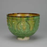 An ancient pottery bowl with applied beaded decoration covered with green and brown glaze | THE MUSEUM OF ORIENTAL CERAMICS, OSAKA (GIFT OF MR. USATO KINJI)