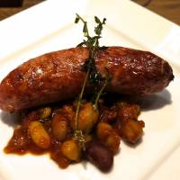 A homemade pork sausage at Kitchen Nakamura. | ROBBIE SWINNERTON