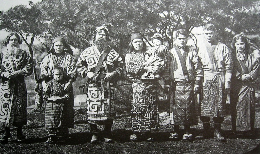 Righting historical wrongs: A group of Ainu are captured on film in 1904, during a period when large numbers of sets of Ainu remains were unearthed by Japanese archaeologists for research and display at universities across the country. | WIKIMEDIA COMMONS