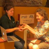 Furry friend: Katie Adler (right) gets up close and personal with a tarantula at the Butterfly Pavilion in Westminster, Colorado, during a recent video shooting for her website. | GEORGIA MANNING