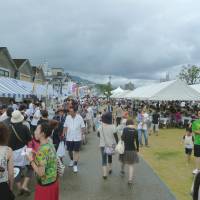Port call: Visitors to last year\'s Kantan Harbor Park festival check out the food stalls selling a variety of local and national fare. | OITA CITY TOURIST ASSOCIATION