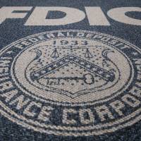 In pursuit: The Federal Deposit Insurance Corp. logo is displayed outside the agency’s headquarters in Washington. FDIC races against time to prosecute bank debacle suspects