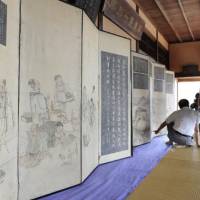 Historical treasures: A pair of screens depicting a town by the Seto Inland Sea and a visiting Korean delegation in the early 19th century are unveiled in Fukuyama, Hiroshima Prefecture, on Wednesday. | KYODO PHOTO