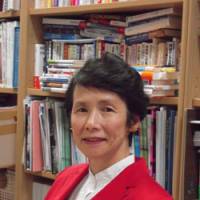 Giving youth a voice: Hitotsubashi University professor Yoko Ishikura is seen at her office at a recent interview with The Japan Times. | MIZUHO AOKI