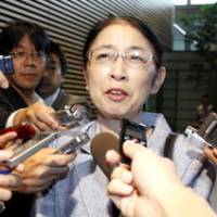 Back at work: Atsuko Muraki , appointed director general for policy planning at the Cabinet Office after being acquitted of fraud charges, speaks to reporters at the Prime Minister\'s Official Residence on Monday. | KYODO PHOTO