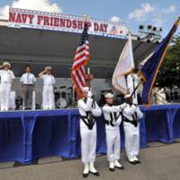 Building ties: U.S. and Japanese military and civilian dignitaries take part in Navy Friendship Day at Yokosuka, Kanagawa Prefecture, on Aug. 7. Below: An American gets ready for a Bon \"odori\" dance during an open house at the Atsugi base in Kanagawa on Aug. 14. | YOSHIAKI MIURA, MINORU MATSUTANI