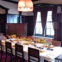Foreign diplomacy: The dinning room of Sadatsuchi Uchida’s house hosted many parties for foreign guests. Left: the door to the entrance hall has art nouveau stained-glass windows. Diplomat's House a Victorian original on Yamate bluff