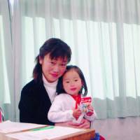 Happy time: Akemi Nakamura holds her 2-year-old daughter, Yuri, in Tokyo in December 2005, four days before the girl lost consciousness. | COURTESY OF AKEMI NAKAMURA