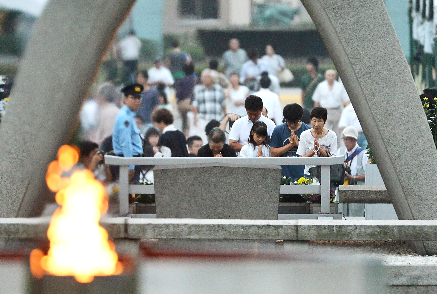 Rite of remembrance: Prayers are offered Tuesday during a ceremony at Peace Memorial Park in Hiroshima to mark the 68th anniversary of the atomic bombing. | COURTESY OF SKYTRUTH