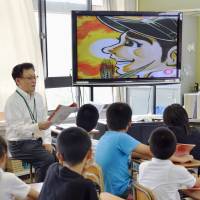 Suddenly taboo: A scene from \"Hadashi no Gen\" is shown on a classroom TV at the Motomachi elementary school in Naka Ward, Hiroshima, in June. | KYODO