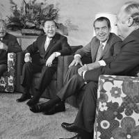 Levity: U.S. President Richard Nixon and Prime Minister Kakuei Tanaka enjoy a laugh with Secretary of State William P. Rogers at the end of a summit in Hawaii on Sept. 1, 1972. Nixon called Tanaka 'nationalistic, new boy'