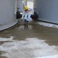 Short straw: A worker checks radiation levels around a contaminated water tank Thursday at the Fukushima No. 1 plant. | TEPCO/AFP-JIJI