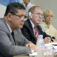 Sympathetic ears: Members of the U.N. Commission of Inquiry on Human Rights in North Korea (from left) Marzuki Darusman, Justice Michael Kirby and Sonja Biserko listen to relatives of Japanese abducted by North Korean agents during a two-day public hearing in Tokyo at U.N. University on Thursday. Right: Sakie Yokota (second from left) speaks about her abducted daughter, Megumi. | KYODO