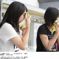 Women in Tatebayashi, Gunma Prefecture, wipe off perspiration on one of the summer\'s hottest days.  | KYODO
