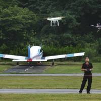 Flights of fancy: A man pilots his aircraft as local drone enthusiasts gather for the Maryland Fly In last month in Laytonsville. A drone of your own in the near future?