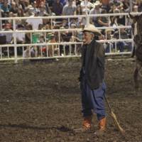 Masking the truth?: A rodeo clown wearing a mask of President Barack Obama is propped up like a straw man with the appearance that a broom stick is going up his backside at the Missouri State Fair in Sedalia on Aug. 10. | AP