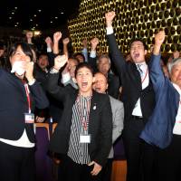 Euphoria: (From left) Olympic medal winners Ai Shibata and Saori Yoshida pump their fists in the air along with alpinist Yuichiro Miura at The Tokyo Chamber of Commerce and Industry in Marunochi, Tokyo, at the moment when the IOC announced the host city of the 2020 Summer Olympics. Tokyo wins bid to host 2020 Olympics