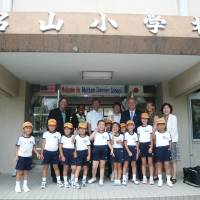 People-to-people exchanges: Mutsumi Katayama (far right) has annually organized
and attended the Japan tours offered for American teachers selected as California Teachers of the Year (CTOY). The CTOY 2012 teachers visit Meizan Elementary School in Kagoshima Prefecture on July 5, 2012, during their tour of Japan.  |  COURTESY OF MUTSUMI KATAYAMA