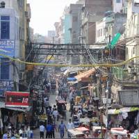 In a jam: In Old Delhi, streets are so narrow and crowded that car traffic is nearly impossible &#8212; and yet India\'s population of 1.27 billion is expected to put an extra 380 million cars on the road over the next two decades. | NOZOMU KAWASHIMA