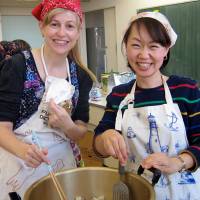 Melting pot:  The writer and a friend make soup for a community event, one of their PTA duties. | COURTESY OF LOUISE GEORGE KITTAKA