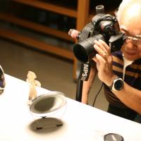 Heritage: Tadahiro Ogawa, seen at work in museums in Nagano Prefecture believes really good photos of Jomon artifacts can greatly help today\'s Japanese connect with their forebears. | EDAN CORKILL