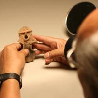 Heritage: Tadahiro Ogawa, seen at work in museums in Nagano Prefecture believes really good photos of Jomon artifacts can greatly help today\'s Japanese connect with their forebears. | .jpg