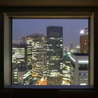 Lighting ’em up: Commercial buildings in Osaka are seen through a window on July 31. Capital spending by Japanese firms rose for the first time in three quarters in the April-June period, the government said Monday. Business investment climbs for first time in three quarters