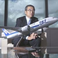 Decision-maker: Shinichiro Ito, president and chief executive officer of ANA Holdings Inc., speaks behind a model of a Boeing Co. 787 Dreamliner for ANA during an interview in Tokyo on Sept. 4. ANA nears decision on maker for 25-plane order