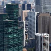 Top tier: Commercial and residential buildings in Tokyo are seen from an observatory in Mori Tower in Roppongi Hills on Sept. 3. | BLOOMBERG