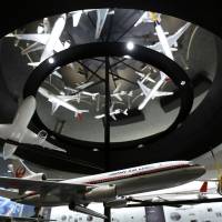 Back in the skies: Models of different Japan Airlines Co. aircraft are displayed in the company\'s maintenance center at Haneda airport in Tokyo in July. | BLOOMBERG