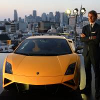 Cut above: Lamborghini CEO Stephan Winkelmann unveils the Gallardo LP 570-4 Squadra Corse sports car at the Lamborghini Aoyama dealership in Tokyo on Friday. | BLOOMBERG