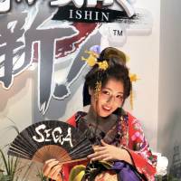 A model advertises Sega\'s \"Yakuza Ishin,\" which launches in February 2014. | YOSHIAKI MIURA